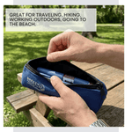 Person holding a blue Breezy product in an outdoor setting 