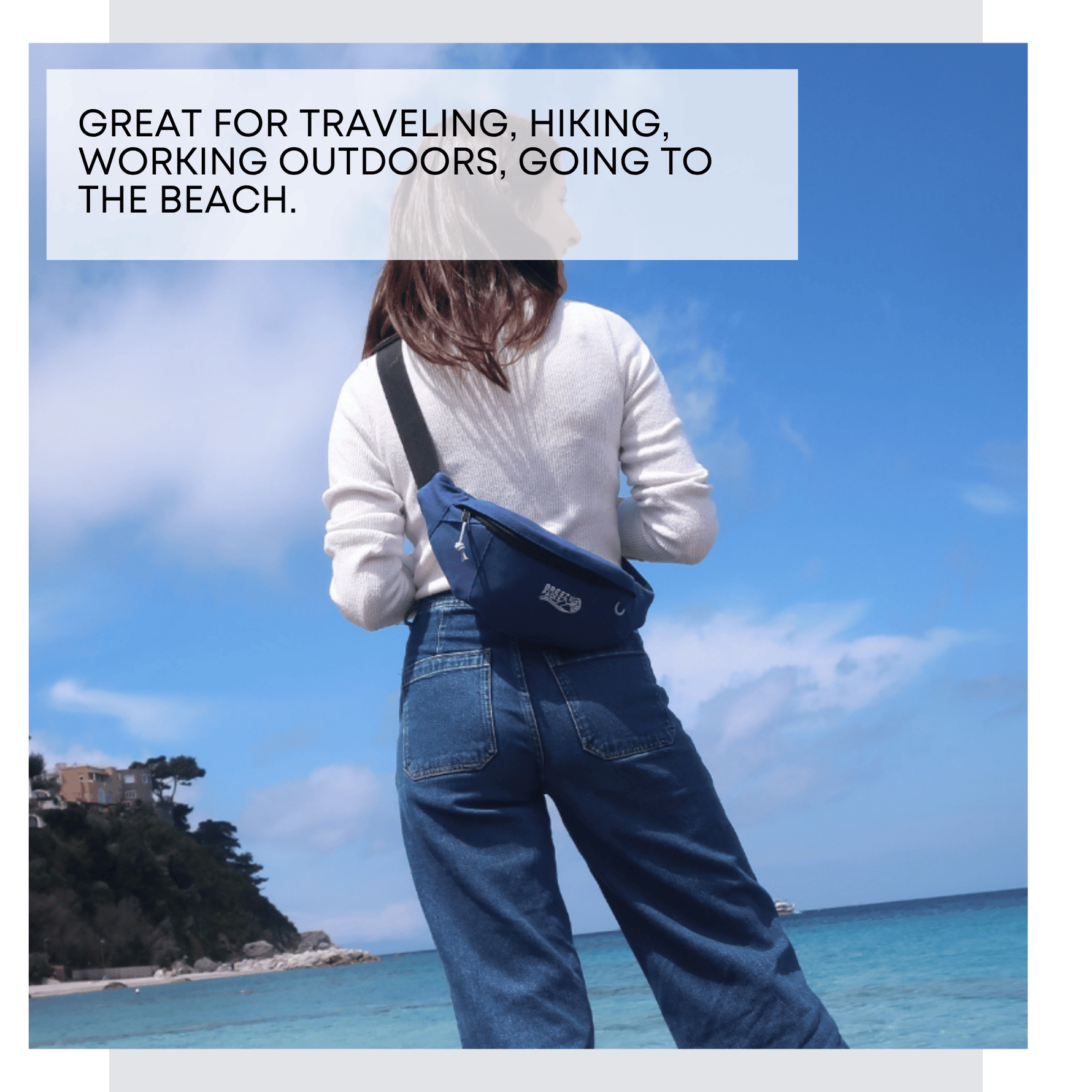 Person wearing a blue crossbody bag with scenic background 