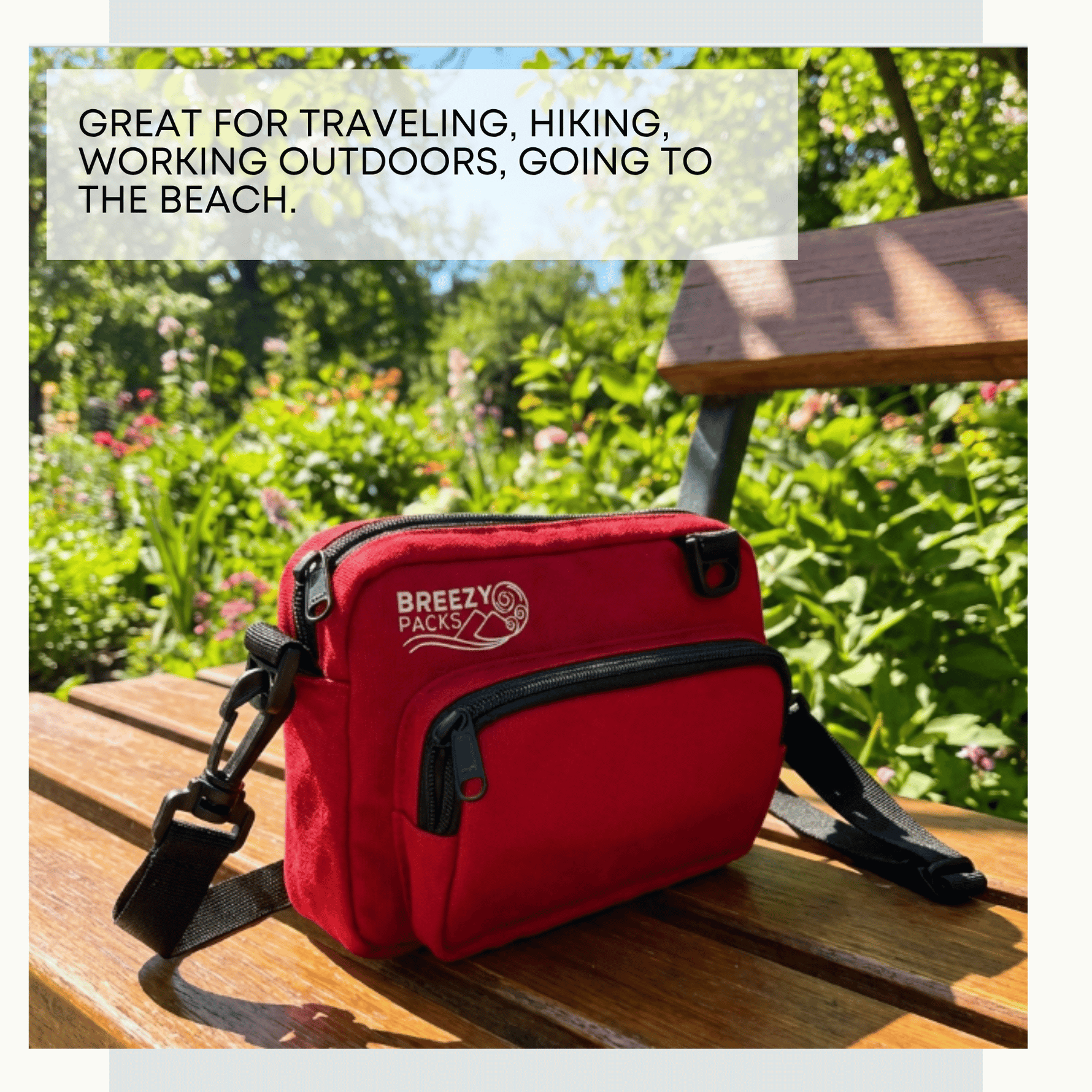 Red bag with 'Breezy Packs' branding on a wooden surface outdoors. 